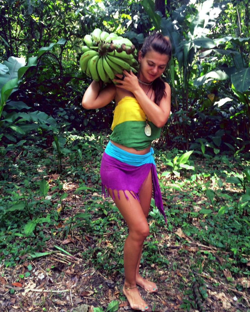 A girl holding bananas