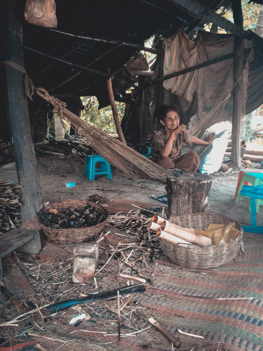 A Cambodian lady selling bamboo sticky rice in Battambang