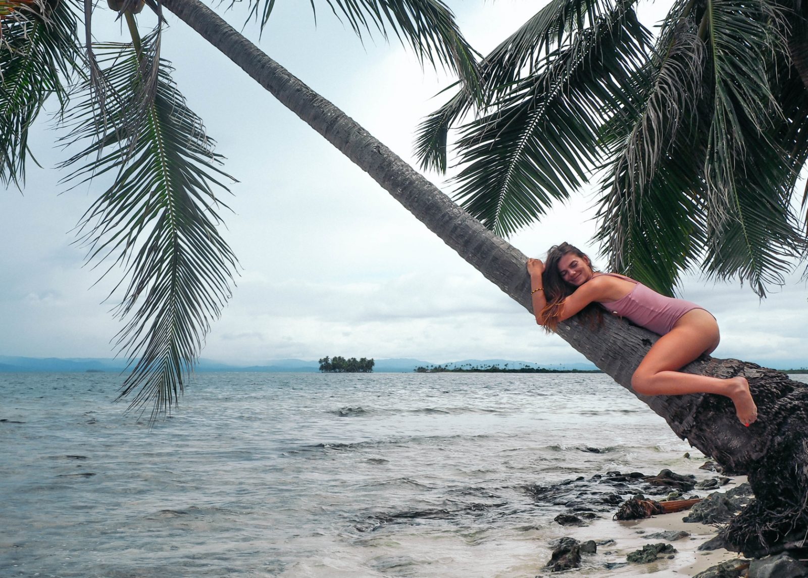 A girl sleeping on the coconut palm