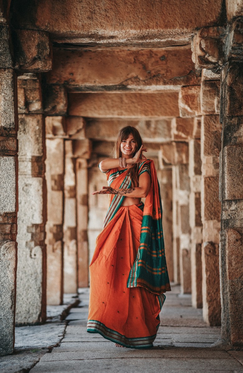 A girl wearing sari in the temple in Hampi