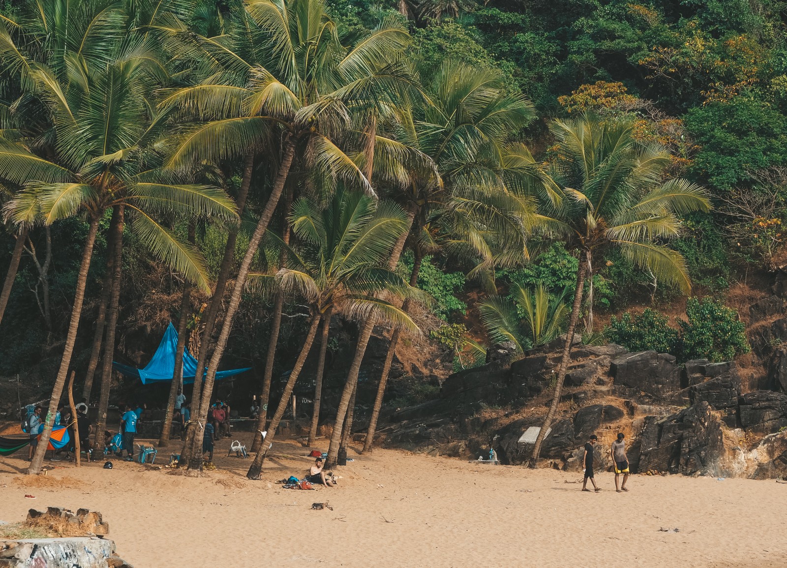 people sitting on the paradise beach in Gokarna