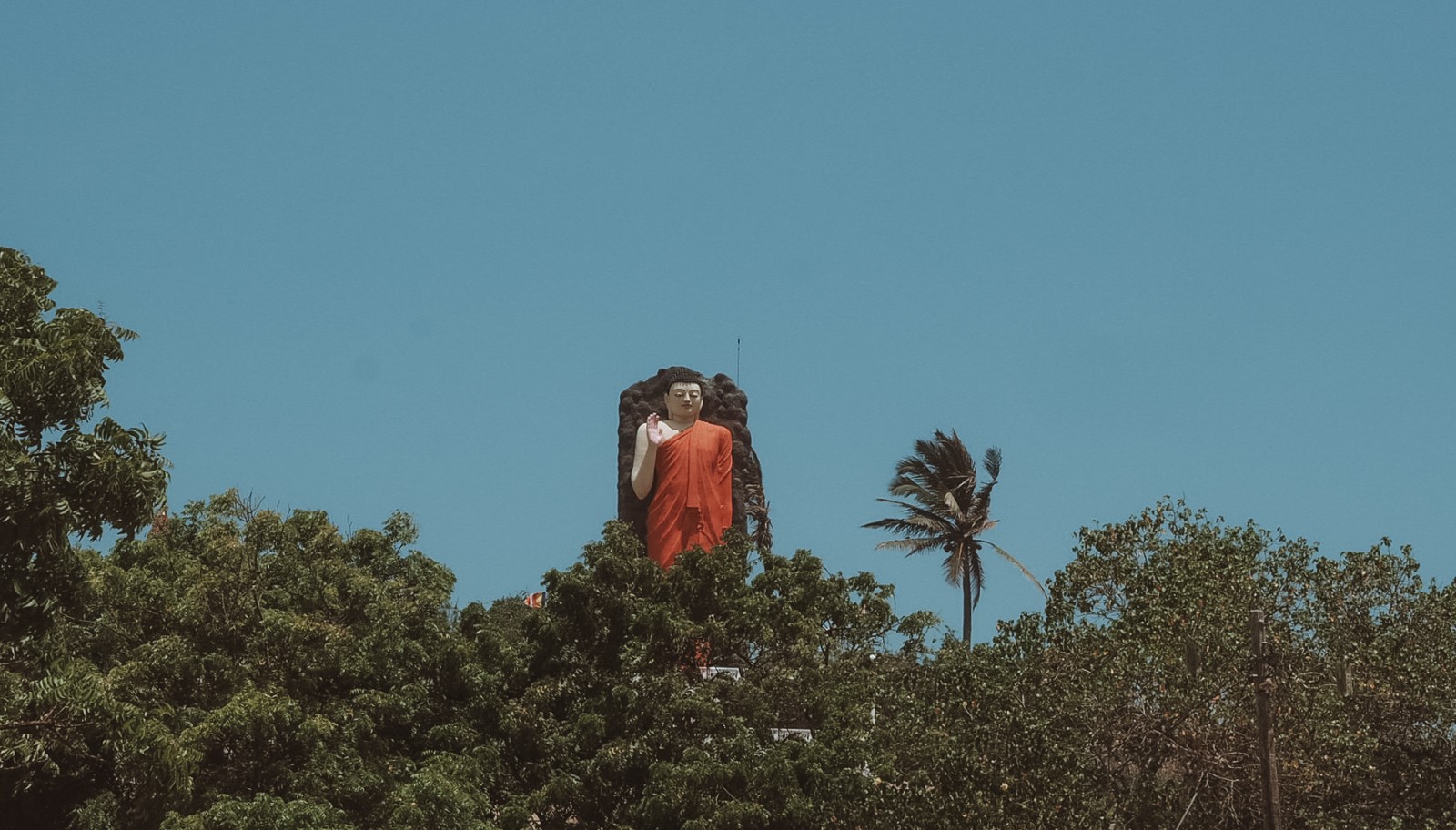 Standing Buddha statue in Sri Lanka
