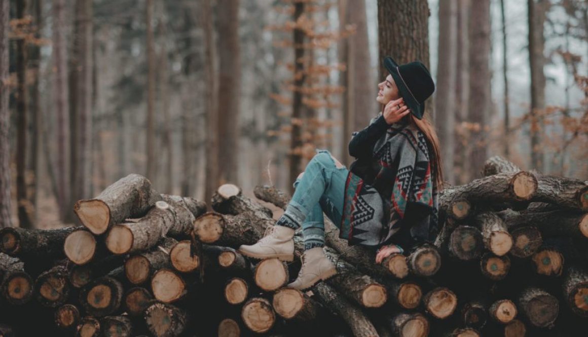 A girl sitting in the woods