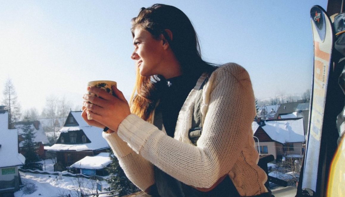 a girl drinking tea in the mountains