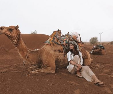 A girl with a camel at safari in Jaisalmer
