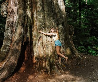 a girl hugging a tree